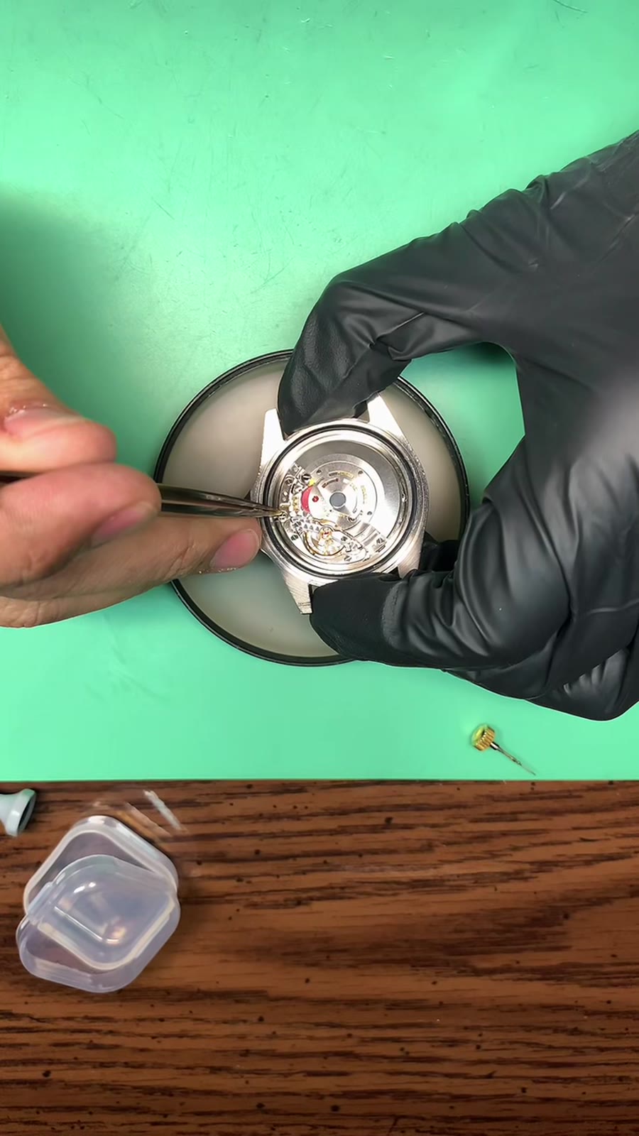 Open watch movement on the bench